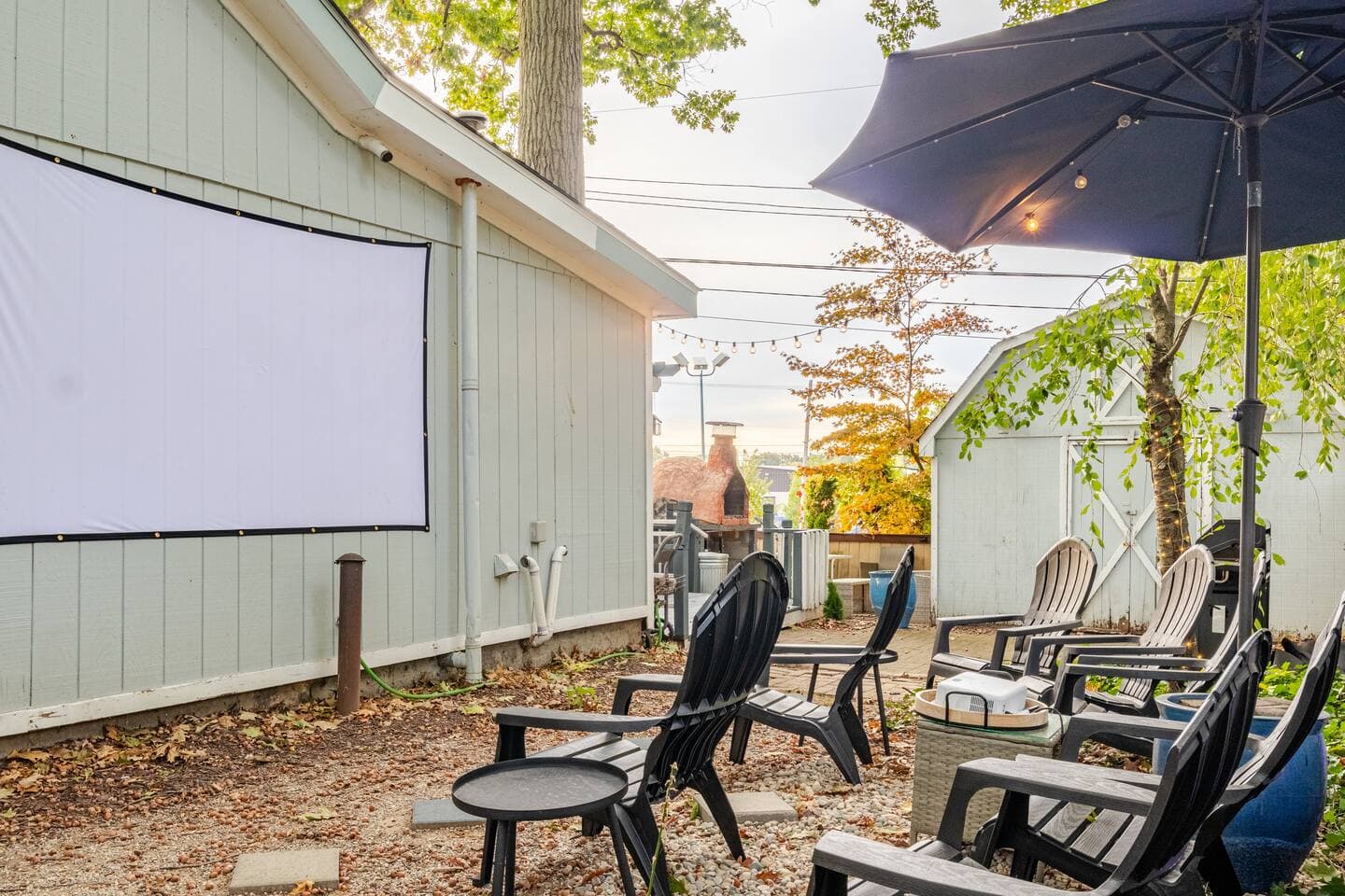 Outdoor movie theater with projector screen